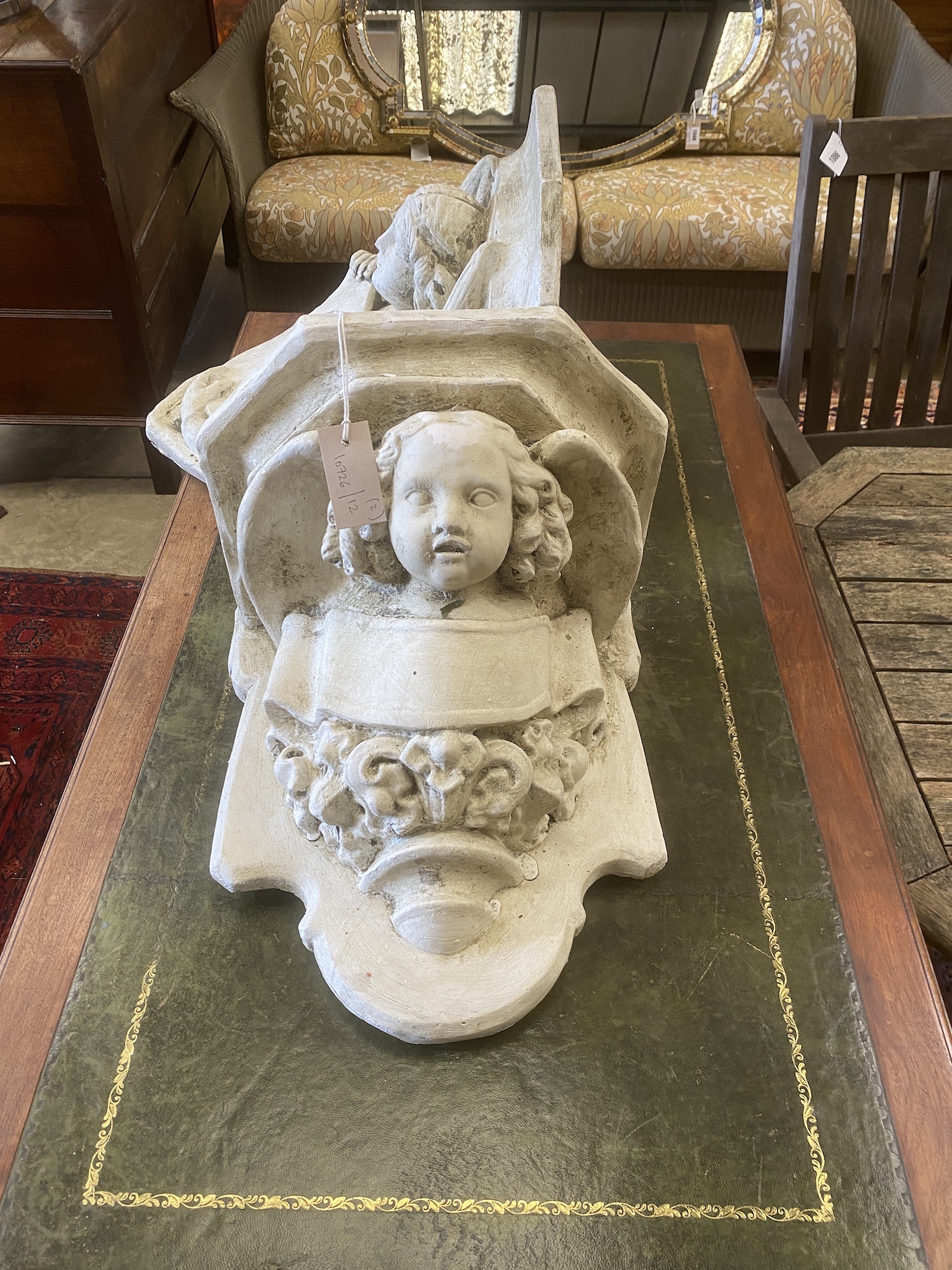 Two painted plaster wall brackets, larger width 42cm, height 44cm